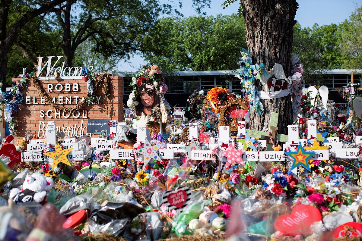 <i>Kaylee Greenlee Beal/Reuters</i><br/>Privacy barriers and bike racks maintain a perimiter at a memorial outside Robb Elementary School