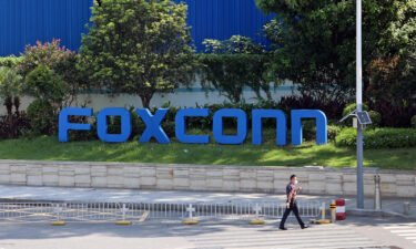 Foxconn says it's restoring production at the world's largest iPhone factory in Shenzhen in south China's Guangdong province.