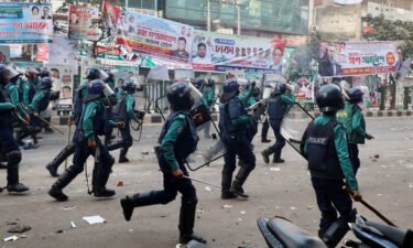 Bangladeshi policemen disperse Bangladesh Nationalist Party (BNP) activists on December 7.