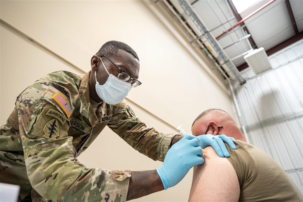 <i>Jon Cherry/Getty Images</i><br/>The House voted on Thursday to pass the defense bill that rescinds the US military's Covid-19 vaccine mandate. A soldier is here getting the Covid vaccine in September 2021 in Fort Knox