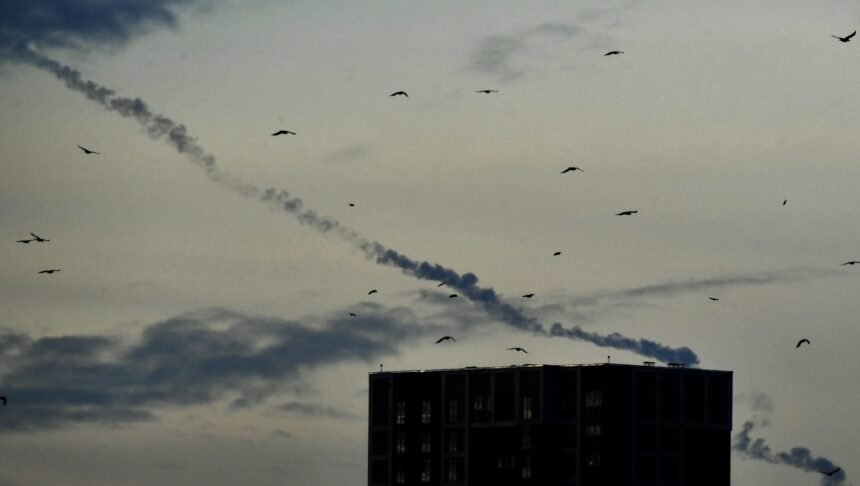 <i>Sergei Supinksy/AFP/Getty Images</i><br/>Missiles contrails seen in the sky over Kyiv amid a wave of Russian attacks.