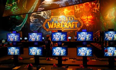 The distributor of the hit game "World of Warcraft" winds down its agreement with Blizzard Entertainment. World of Warcraft gaming booths are seen at the Gamescom 2015 fair in Cologne