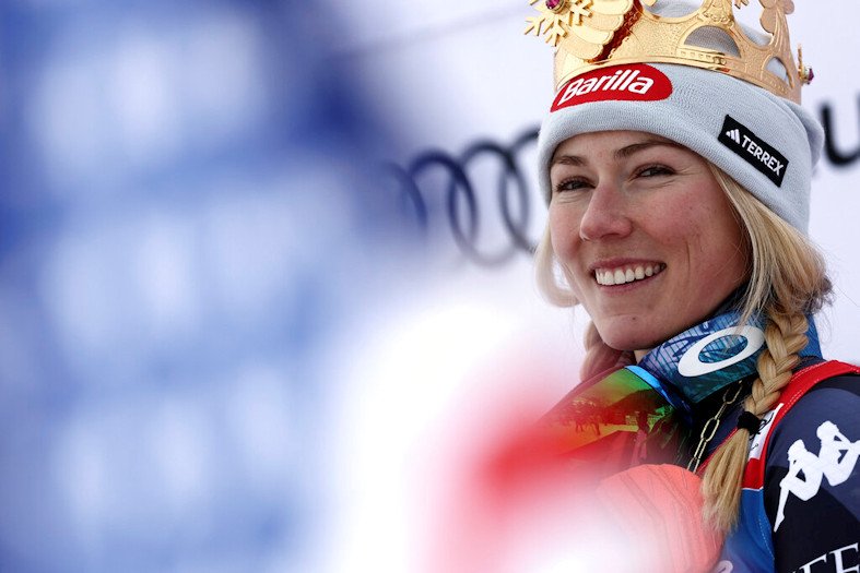 Mikaela Shiffrin smiles on the podium after winning an alpine ski, women's World Cup giant slalom, in Kronplatz, Italy on Tuesdsay
