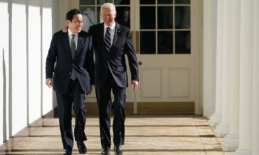 US President Joe Biden and Japanese Prime Minister Fumio Kishida walk through the colonnade of the White House in Washington