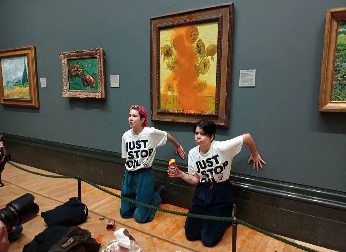 <i>Just Stop Oil/Handout/Anadolu Agency/Getty Images</i><br/>Climate protesters hold a demonstration as they throw cans of tomato soup at Vincent van Gogh's 