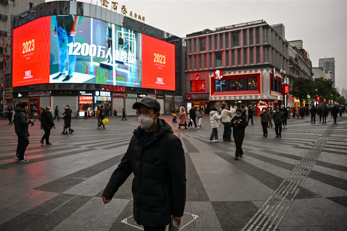 <i>Hector Retamal/AFP/Getty Images</i><br/>People walk on a street in Wuhan