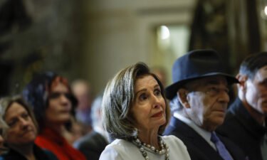 Former House Speaker Nancy Pelosi says her husband's recovery will still take "a little while." The couple are pictured here at the U.S. Capitol on December 14