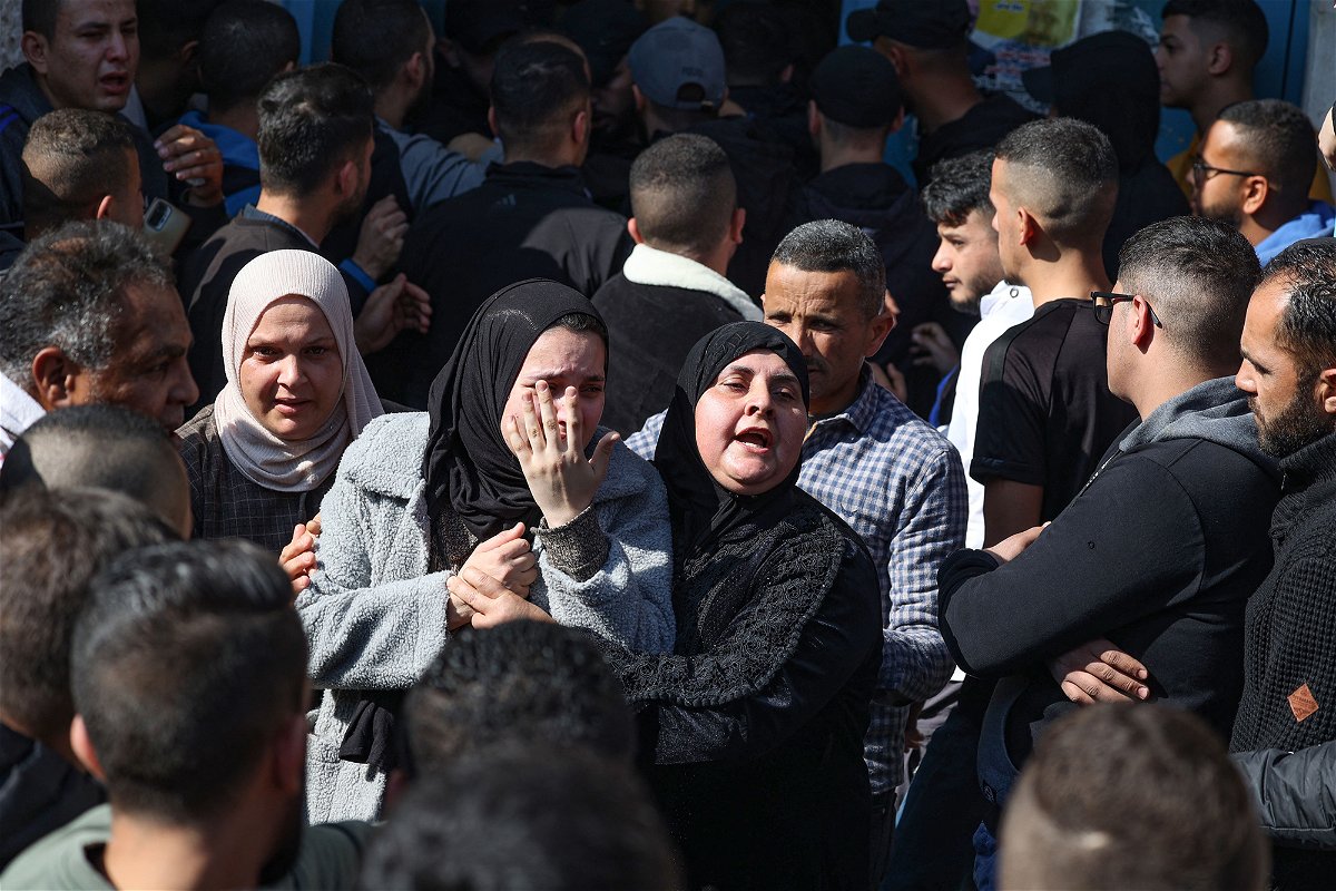 <i>Jaafar Ashtiyeh/AFP/Getty Images</i><br/>Family members of one of the Palestinian people killed during the Israeli raid on January 26