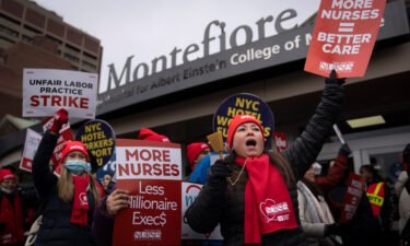 Protestors march on the streets around Montefiore Medical Center during a nursing strike on January 11 in the Bronx borough of New York.
