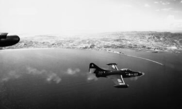 A Grumman F9F Panther fighter jet fires its guns during an attack on the North Korean port of Hungnam in 1951.