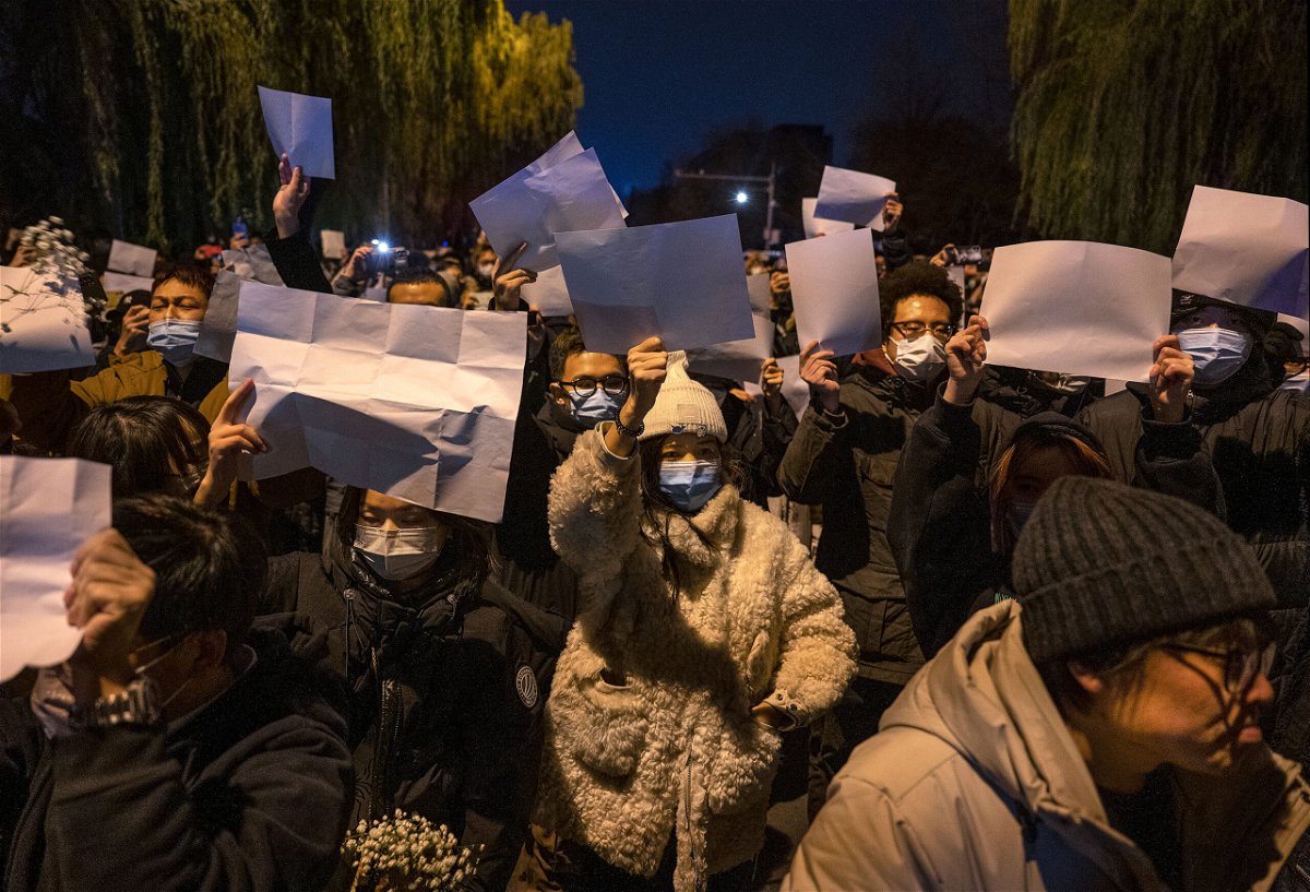 <i>Kevin Frayer/Getty Images</i><br/>People hold up blank pieces of paper during a protest against China's zero-Covid measures on November 27