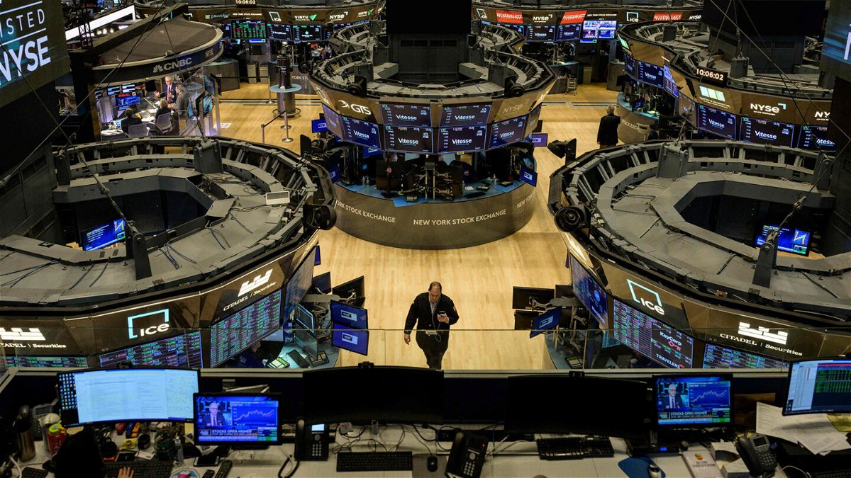 <i>Angela Weiss/AFP/Getty Images</i><br/>Traders work on the floor of the New York Stock Exchange during opening bell in New York City on January 18