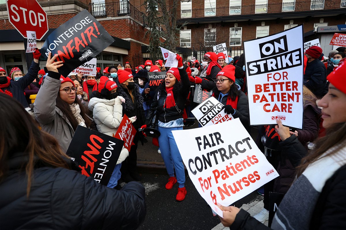 <i>Mike Segar/Reuters</i><br/>Union nurses chant slogans on the picket line outside Montefiore Hospital in the Bronx borough of New York City