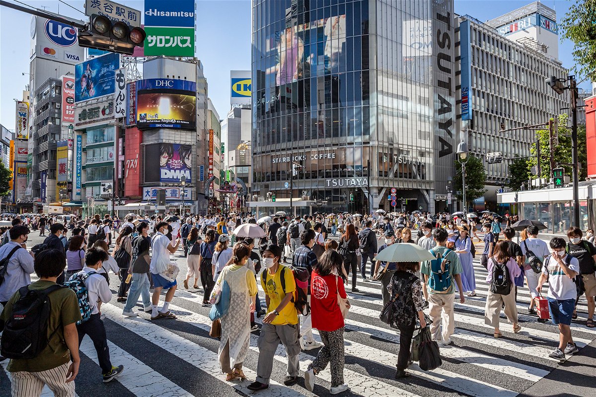 <i>Yuichi Yamazaki/Getty Images</i><br/>Japan is offering to pay families to move out of overcrowded Tokyo. People walk through Shibuya Crossing in Tokyo on July 29