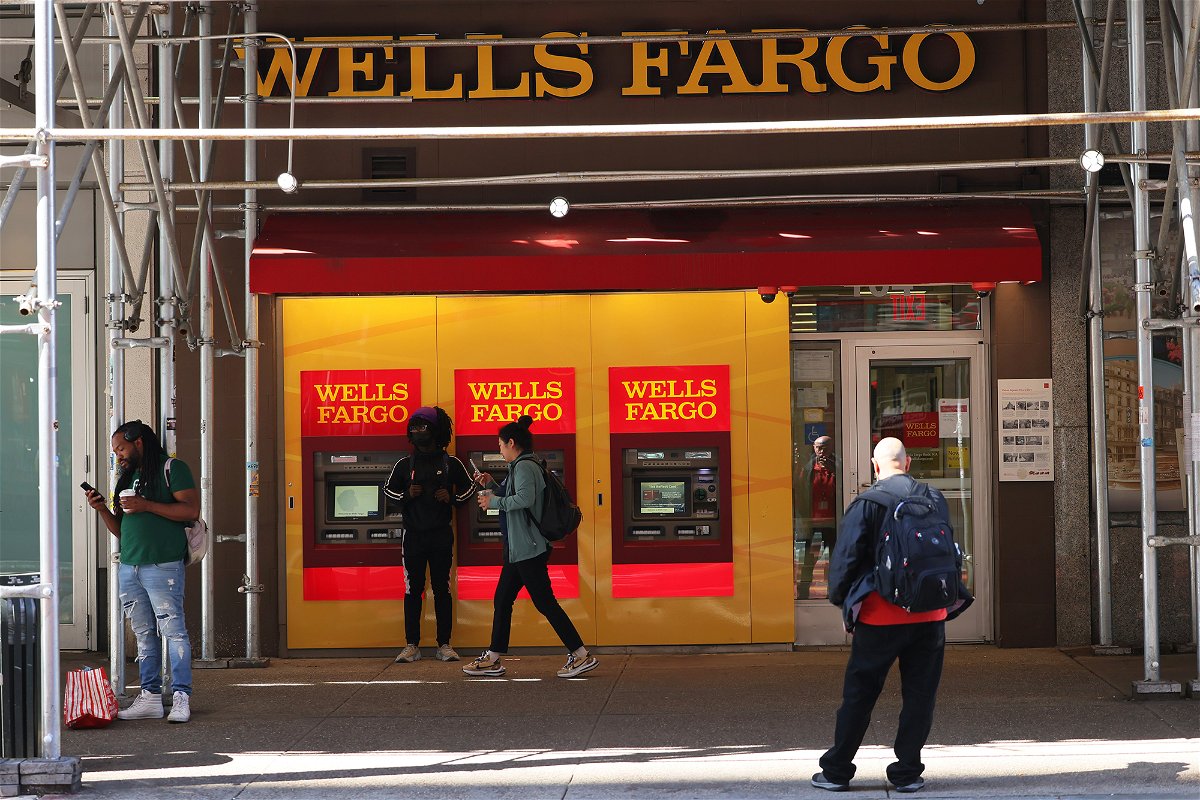<i>Michael M. Santiago/Getty Images</i><br/>People walk past a Wells Fargo Bank in June of 2022 in New York City.