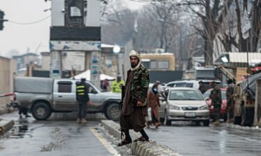 A Taliban security guard is pictured here on a blocked road after a blast near Afghanistan's Foreign Ministry at Zanbaq Square in Kabul on January 11.