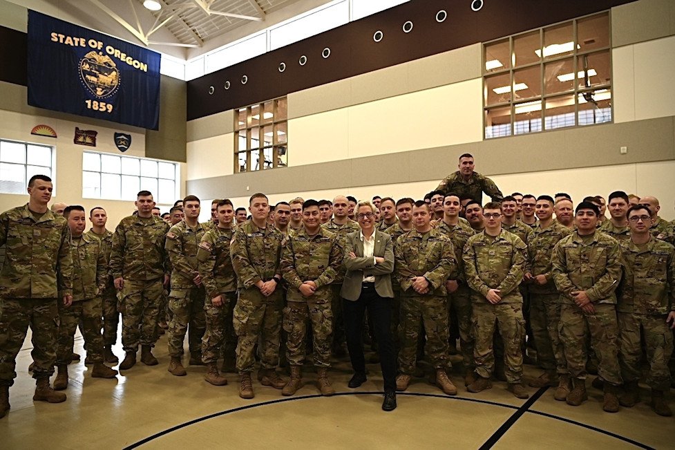  Oregon Gov. Tina Kotek poses with Soldiers in Charlie Company, 1st Squadron, 82nd Cavalry Regiment, Oregon Army National Guard, after their demobilization ceremony Saturday at Camp Withycombe in Clackamas