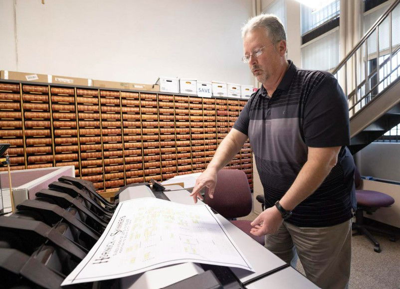 <i></i><br/>Map preservationist Ron Koch stands beside the scanner he used to digitize the original document in the records office at the Woodbury County Courthouse in Sioux City on January 17