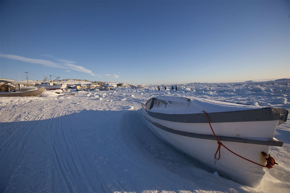 <i>Geoff Robins/AFP/Getty Images</i><br/>A boat sits along the frozen shoreline in Iqaluit