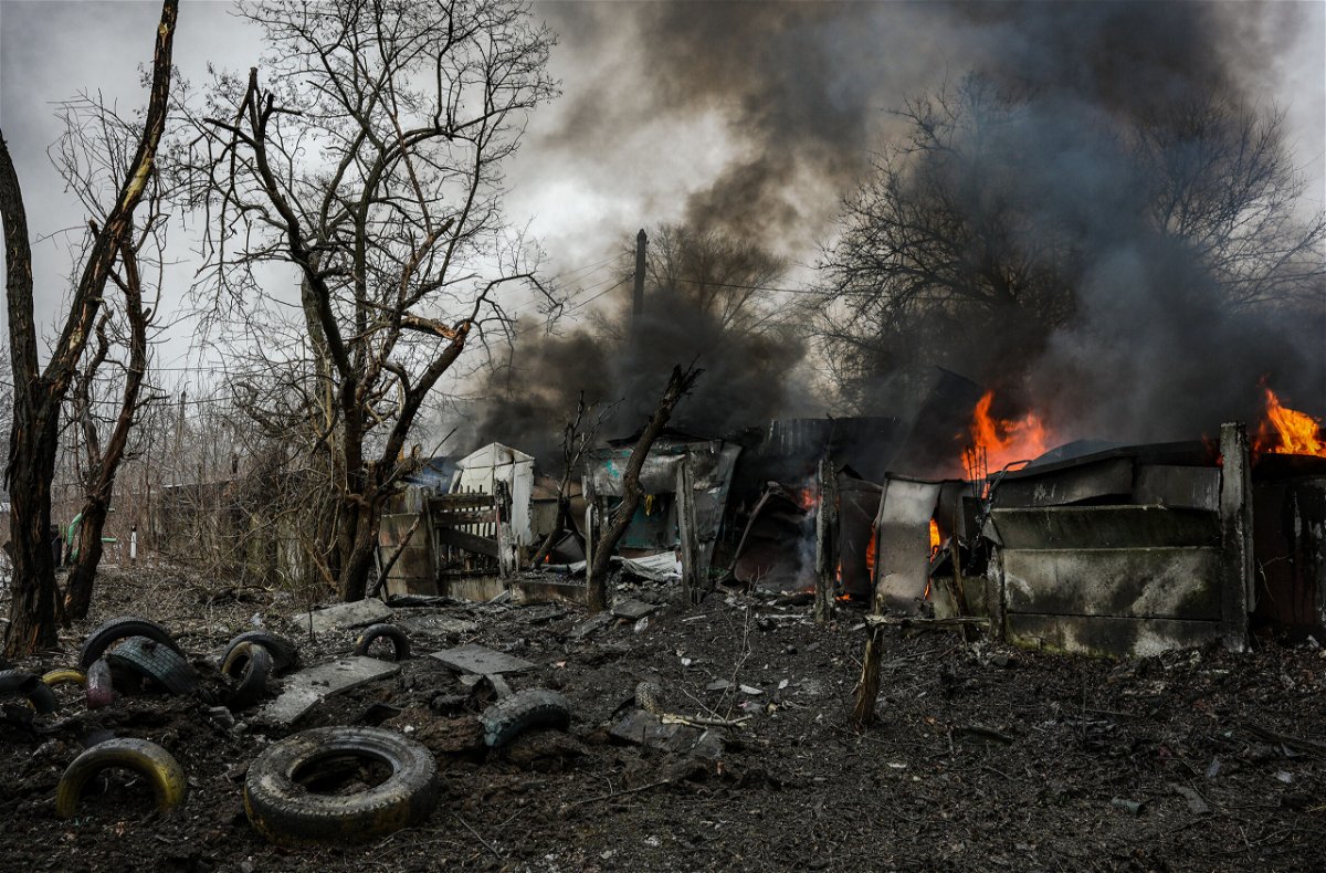 <i>Serhii Mykhalchuk/Global Images Ukraine/Getty Images</i><br/>Garages are pictured on fire after missile strike on February 2
