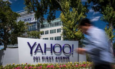 A man walks past Oath Inc. Yahoo! signage displayed at the company's headquarters in Sunnyvale