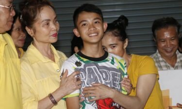 Relatives of Duangphet Phromthep greet him following his rescue in July 2018.