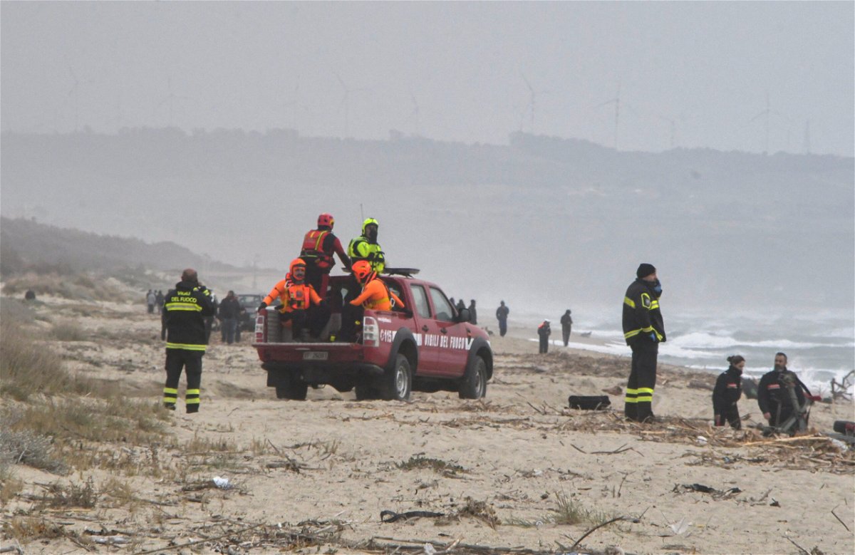 <i>Giuseppe Pipita/Reuters</i><br/>Rescuers arrive at the beach where bodies were found after a migrant shipwreck