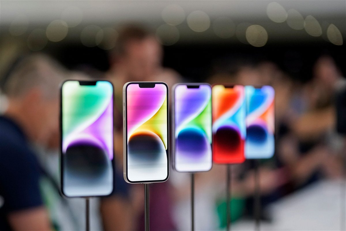 <i>Jeff Chiu/AP</i><br/>New iPhone 14 models are pictured here on display at an Apple event on the campus of Apple's headquarters in Cupertino