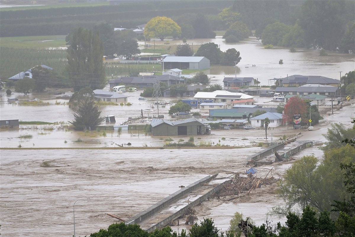 <i>Kerry Marshall/Getty Images</i><br/>The Waiohiki bridge on the Tutaekuri River is washed away and houses flooded on February 14 in Napier