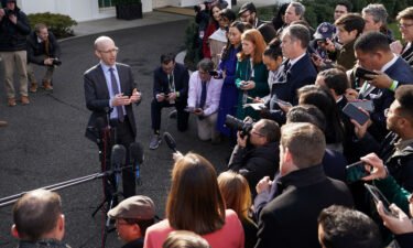 White House spokesman Ian Sams speaks to reporters in front of the West Wing of the White House in Washington
