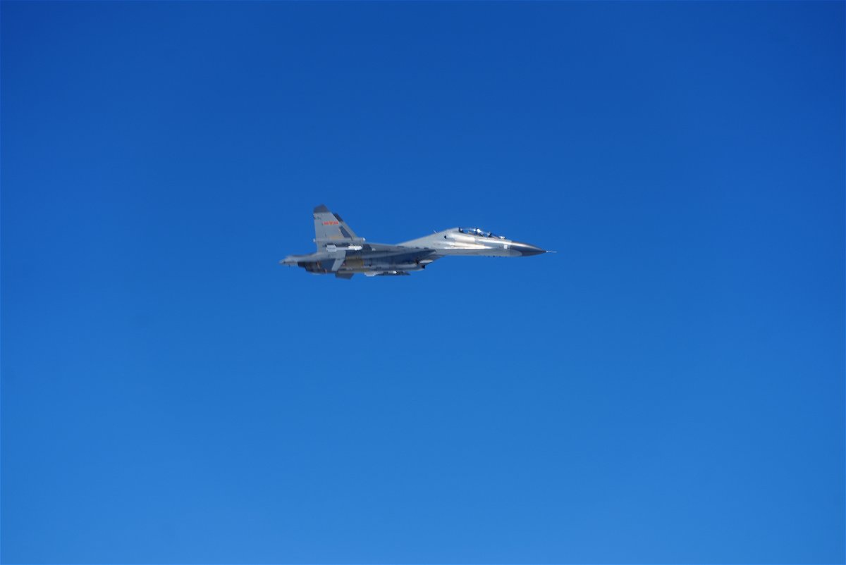 <i>Dan Campesi/CNN</i><br/>Chinese PLA J-11 fighter jet near the Paracel Island over the South China Sea on Friday.