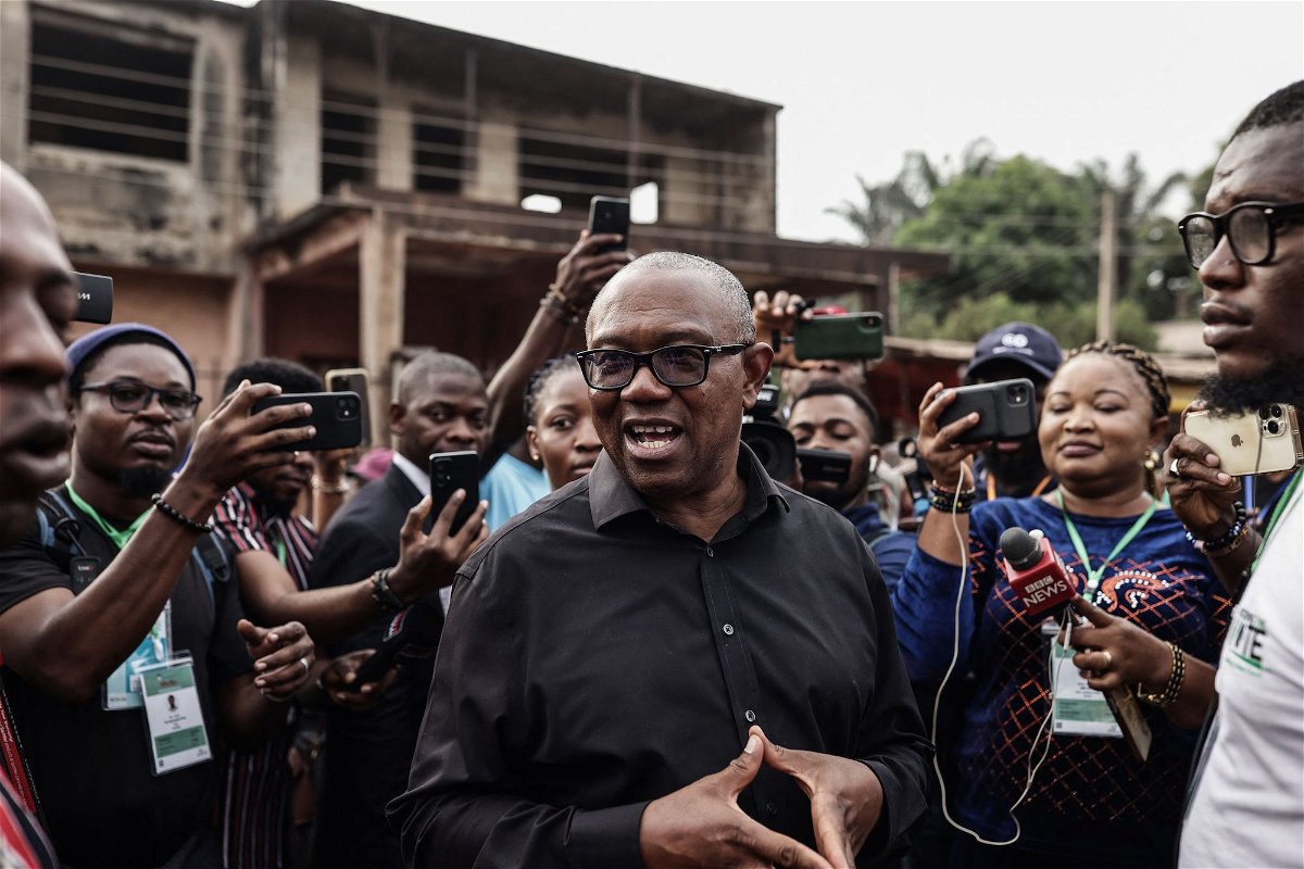 <i>Patrick Meinhardt/AFP/Getty Images</i><br/>Labour Party presidential candidate Peter Obi (center) talks to the media outside a polling station in Amatutu on February 25