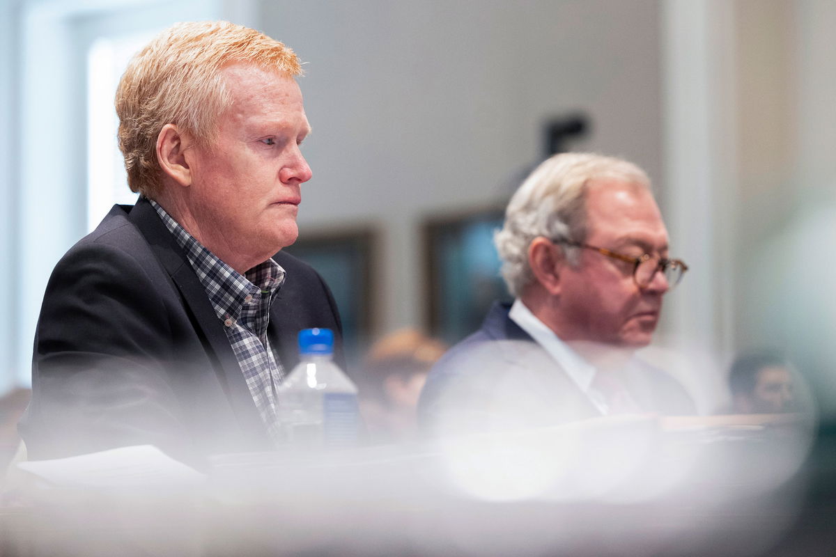 Buster Murdaugh, right, the son of Alex Murdaugh, listens to a