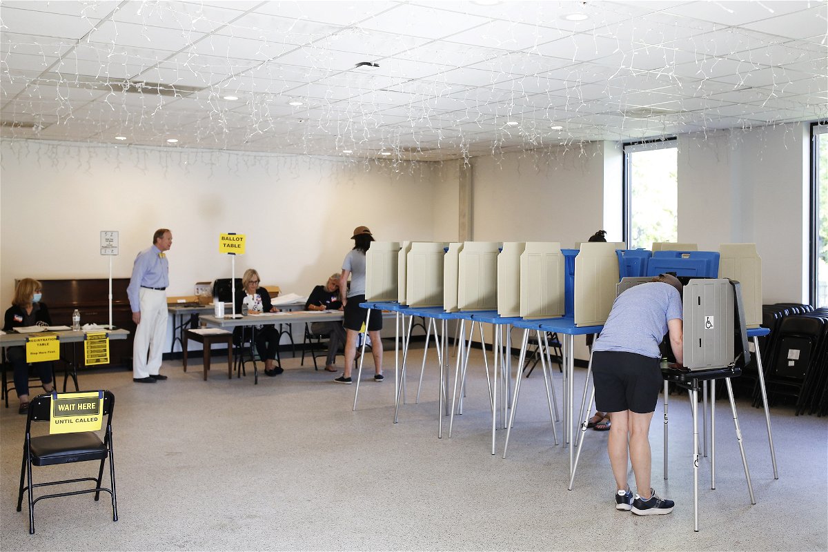 <i>Eamon Queeney/The Washington Post/Getty Images</i><br/>Voters are seen here at booths at Our Savior Lutheran Church in Raleigh