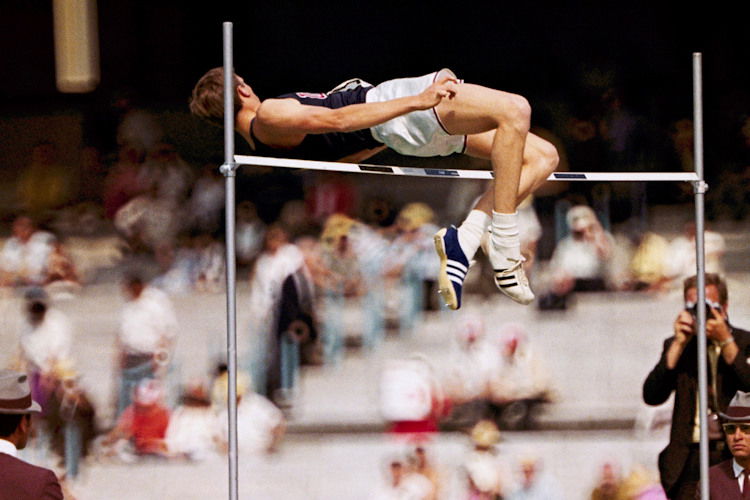 Dick Fosbury, of the United States, clears the bar in the high jump competition at the 1968 Mexico City Olympics