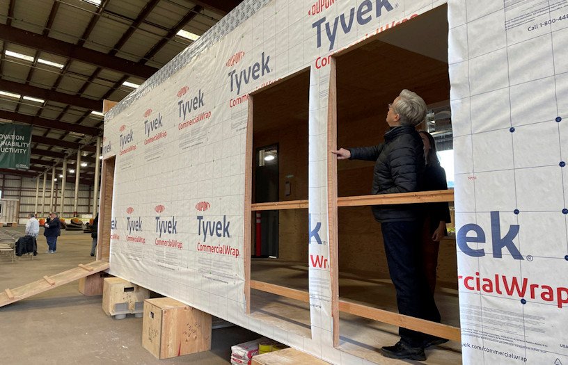 Gov. Tina Kotek examines a mass timber affordable housing prototype at the Port of Portland on Jan. 27