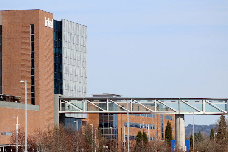 Workers walk on a skybridge to and from a large Intel facility in Hillsboro on March 17, 2023. Intel, which produces semiconductor chips, is Oregon's biggest corporate employer