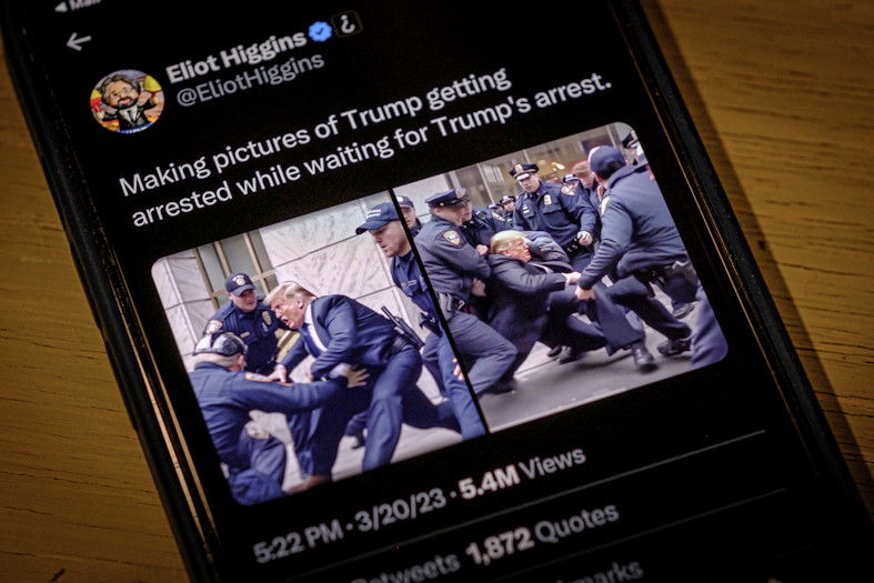 Images created by Eliot Higgins with the use of artificial intelligence show a fictitious skirmish with Donald Trump and New York City police officers posted on Higgins' Twitter account, as photographed on an iPhone. The highly detailed, sensational images, which are not real, were produced using a sophisticated and widely accessible image generator