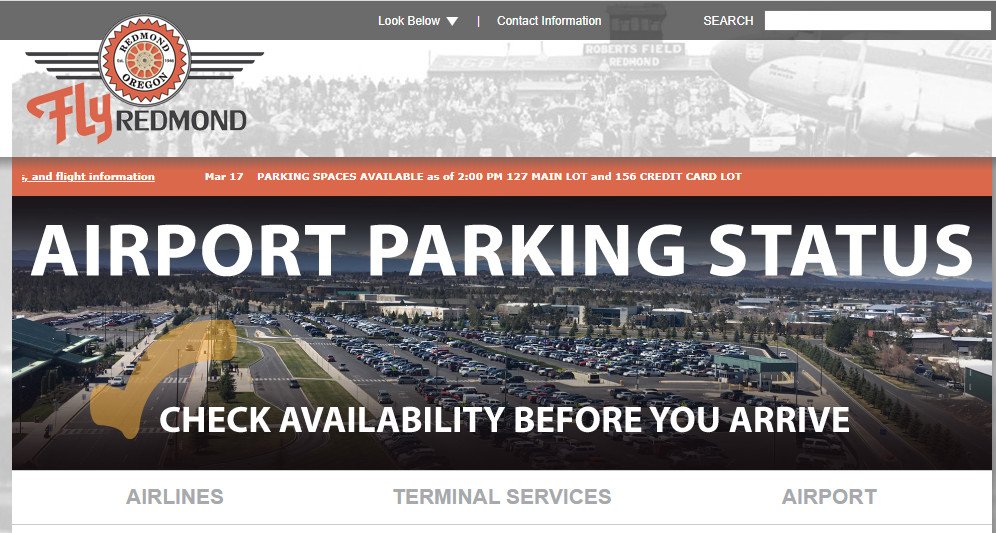 Redmond Airport website has scrolling message atop with available parking