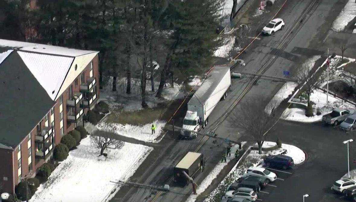 <i>WCVB</i><br/>Several utility poles fell onto a Stoneham street after a crash involving a tractor-trailer on Montvale Avenue.