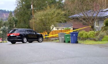 Authorities cordon off the scene of a fatal shooting in Redmond