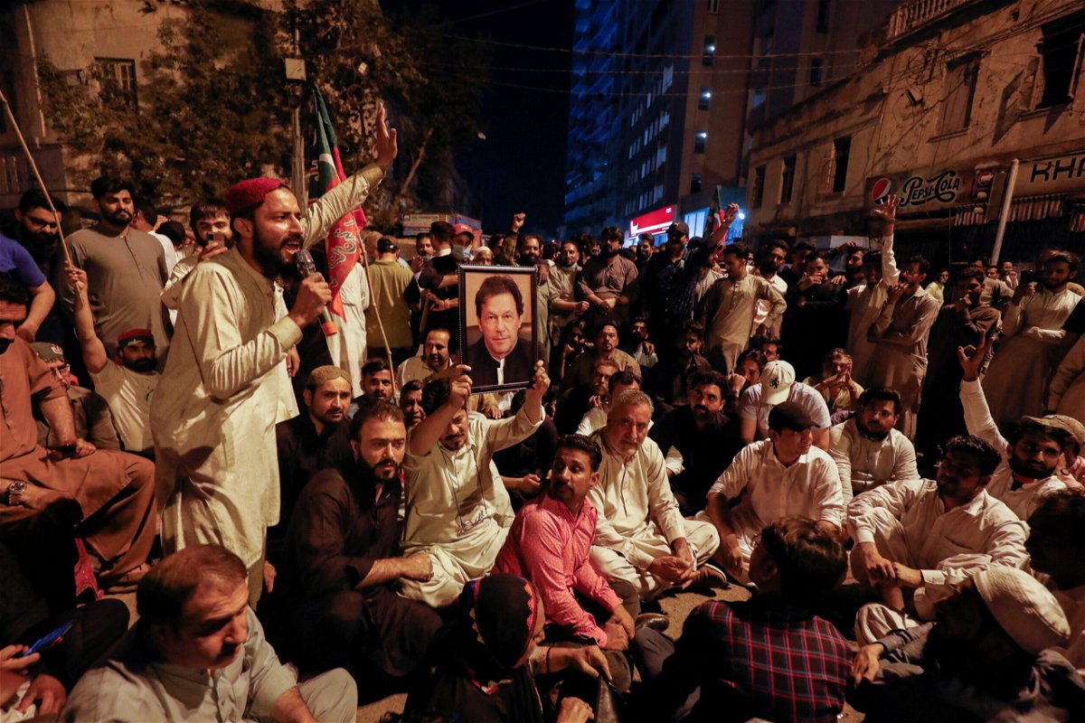 <i>Akhtar Soomro/Reuters</i><br/>Supporters of former Pakistani Prime Minister Imran Khan chant slogans as they protest