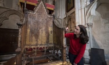 Conservator Krista Blessley works on the restoration of the 700-year-old chair