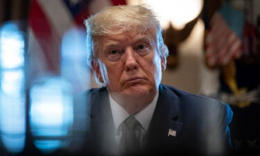 Then-President Donald Trump leads a meeting with travel and tourism industry executives to discuss economic response to the coronavirus outbreak in the Cabinet Room of the White House on March 17