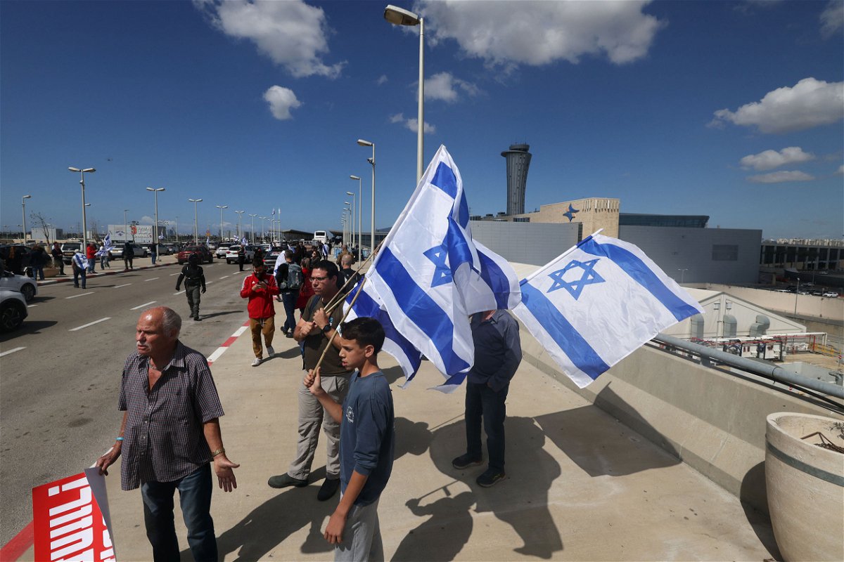 <i>Ahmad Gharabli/AFP/Getty Images</i><br/>Israelis protesting against the government's controversial judicial reforms block the main road leading to Ben Gurion Airport on March 9.