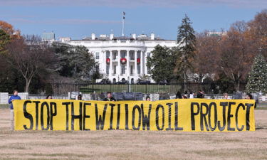 Demonstrators unfurl an anti-Willow Project banner outside the White House on December 2.