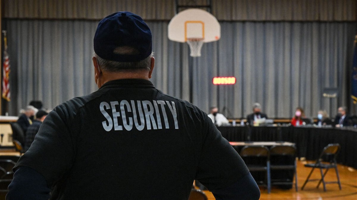 <i>Kylie Cooper/AFP/Getty Images</i><br/>A Pennsbury School District security guard observes a Pennsbury School Board meeting in Levittown