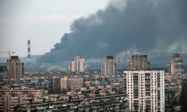 A plume of smoke rises above an infrastructure facility in the Holosiivskyi district during Russia's mass missile attack on Ukraine