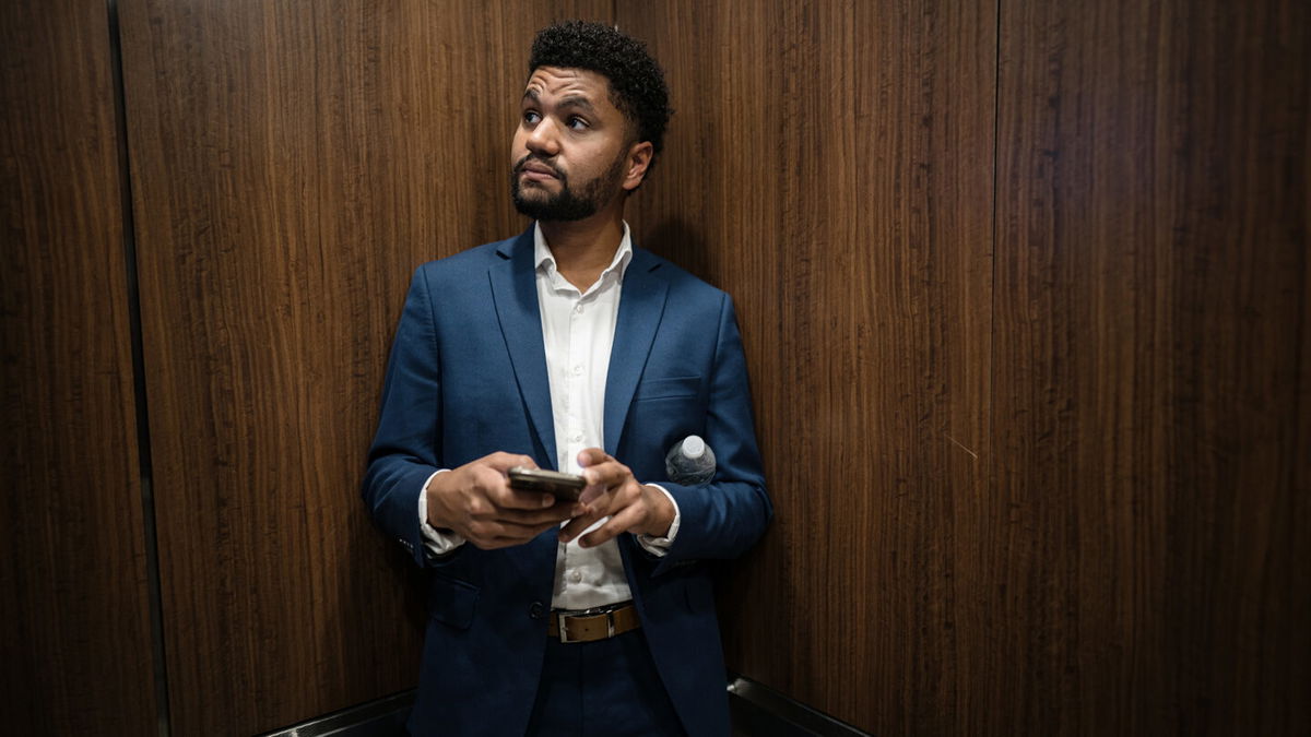 <i>Thomas Simonetti/The Washington Post/Getty Images</i><br/>Maxwell Frost rides an elevator on his way to be interviewed on a podcast in Orlando