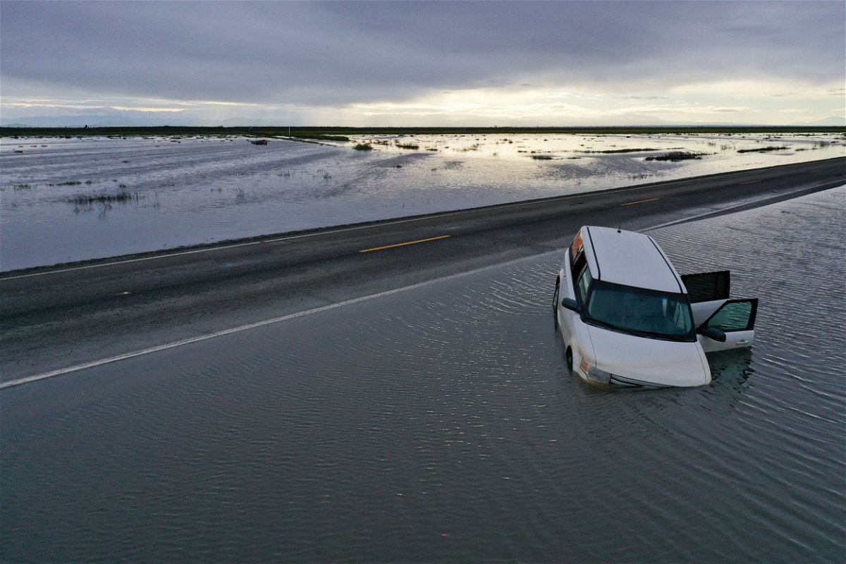 <i>Patrick T. Fallon/AFP/Getty Images</i><br/>A vehicle submerges in flood waters in the Central Valley on March 22.
